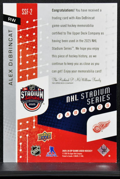2025-26 SP Game Used Stadium Series Fabrics Alex DeBrincat Red Wings Jersey 9577