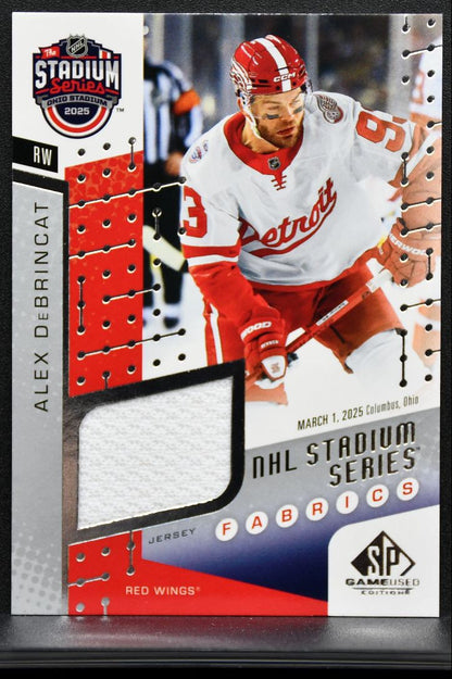 2025-26 SP Game Used Stadium Series Fabrics Alex DeBrincat Red Wings Jersey 9577