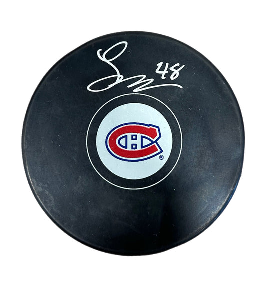 Lane Hutson Autographed Puck - Logo